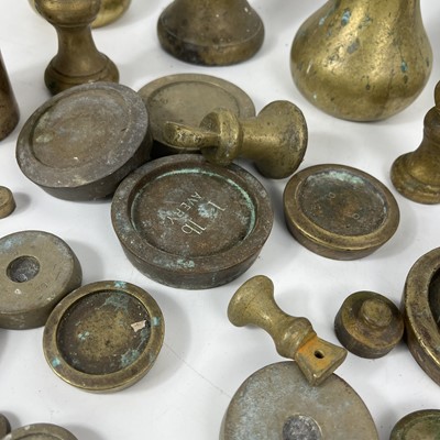 Lot 83 - A collection of various brass postal weights.