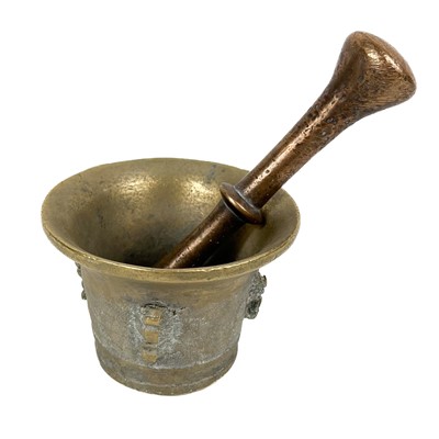 Lot 74 - A brass mortar and pestle.