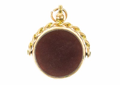 Lot 57 - A Victorian 9ct rose gold mounted carnelian and bloodstone set swivel fob.