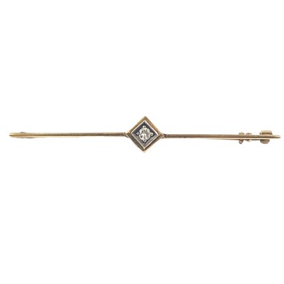 Lot 339 - A high-purity gold (tested 14ct) diamond set bar brooch.