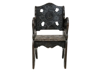 Lot 42 - A Japanese Arts and Crafts floral carved armchair.