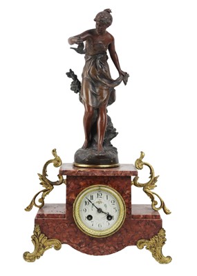 Lot 368 - A French rouge marble and spelter mantel clock.