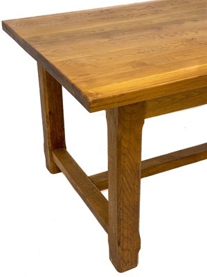 Lot 677 - A contemporary oak dining table.