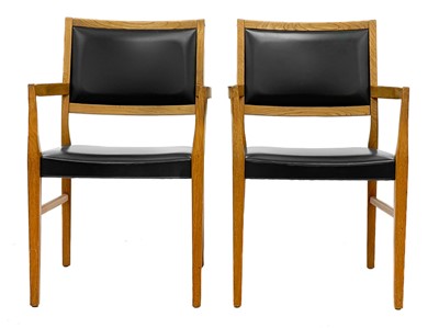 Lot 635 - A pair of mid century Svegards Markaryd teak and vinyl armchairs