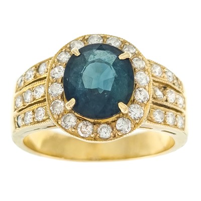 Lot 95 - An 18ct diamond and blue/green colour change sapphire ring.