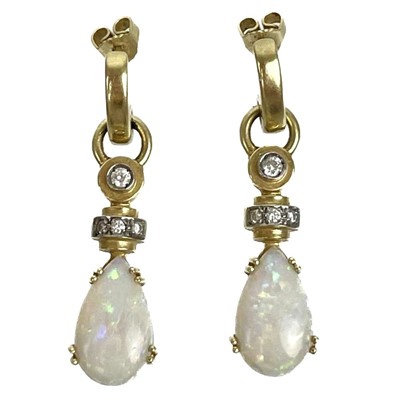 Lot 259 - A 14ct contemporary pair of white opal and diamond set pendant earrings.