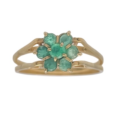 Lot 129 - A cluster gem set reversible gold ring.