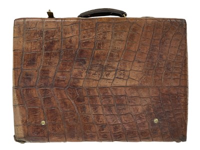 Lot 161 - A good quality crocodile skin and brass bound suitcase.