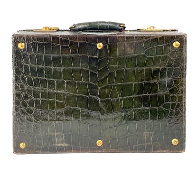 Lot 531 - A good Edwardian Harrods London crocodile leather vanity suitcase with 9ct bottles.