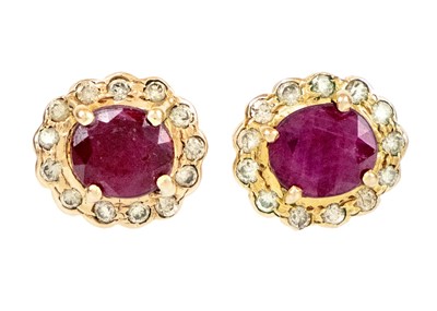 Lot 85 - A pair of 14ct ruby and diamond cluster stud earrings.