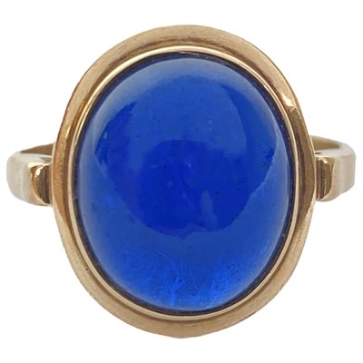 Lot 43 - A 14ct white opal set three stone ring, and a cabochon blue spinel 14ct ring.