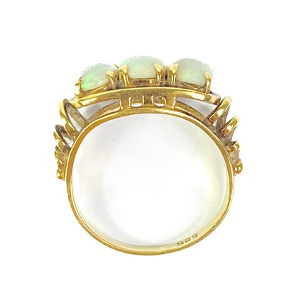 Lot 43 - A 14ct white opal set three stone ring, and a cabochon blue spinel 14ct ring.