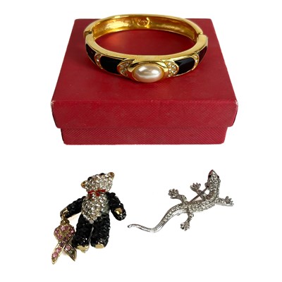 Lot 422 - A Napier Bangle and two Butler and Wilson brooches.