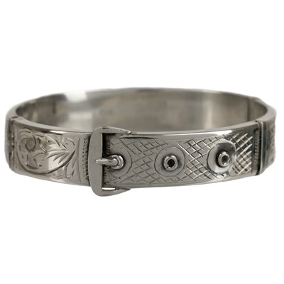 Lot 395 - A silver bangle and cross pendant necklace.