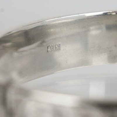 Lot 395 - A silver bangle and cross pendant necklace.