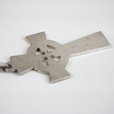 Lot 395 - A silver bangle and cross pendant necklace.