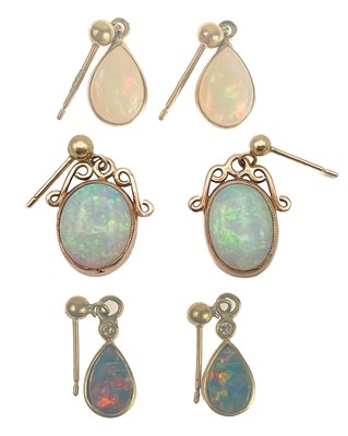 Lot 202 - Three pairs of 9ct mounted opal pendant earrings.