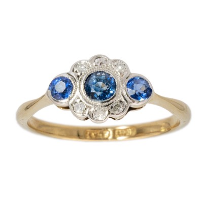 Lot 116 - An 18ct gold and platinum collet set diamond and sapphire ring.