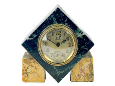 Lot 238 - An Art Deco marble alarm clock with Brevete movement.