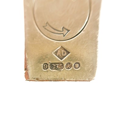 Lot 464 - An Alfred Dunhill 9ct gold engine turned lighter with fitted original box.