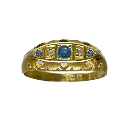 Lot 290 - A Victorian 18ct diamond and sapphire set five stone ring.