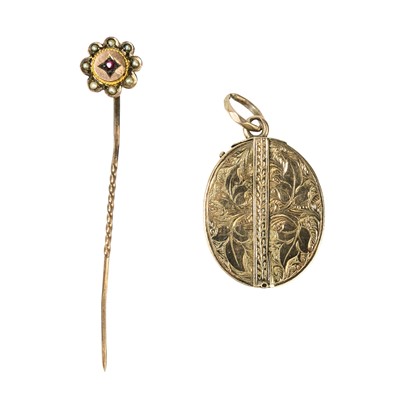 Lot 17 - A Victorian embossed gold central hinged locket pendant.