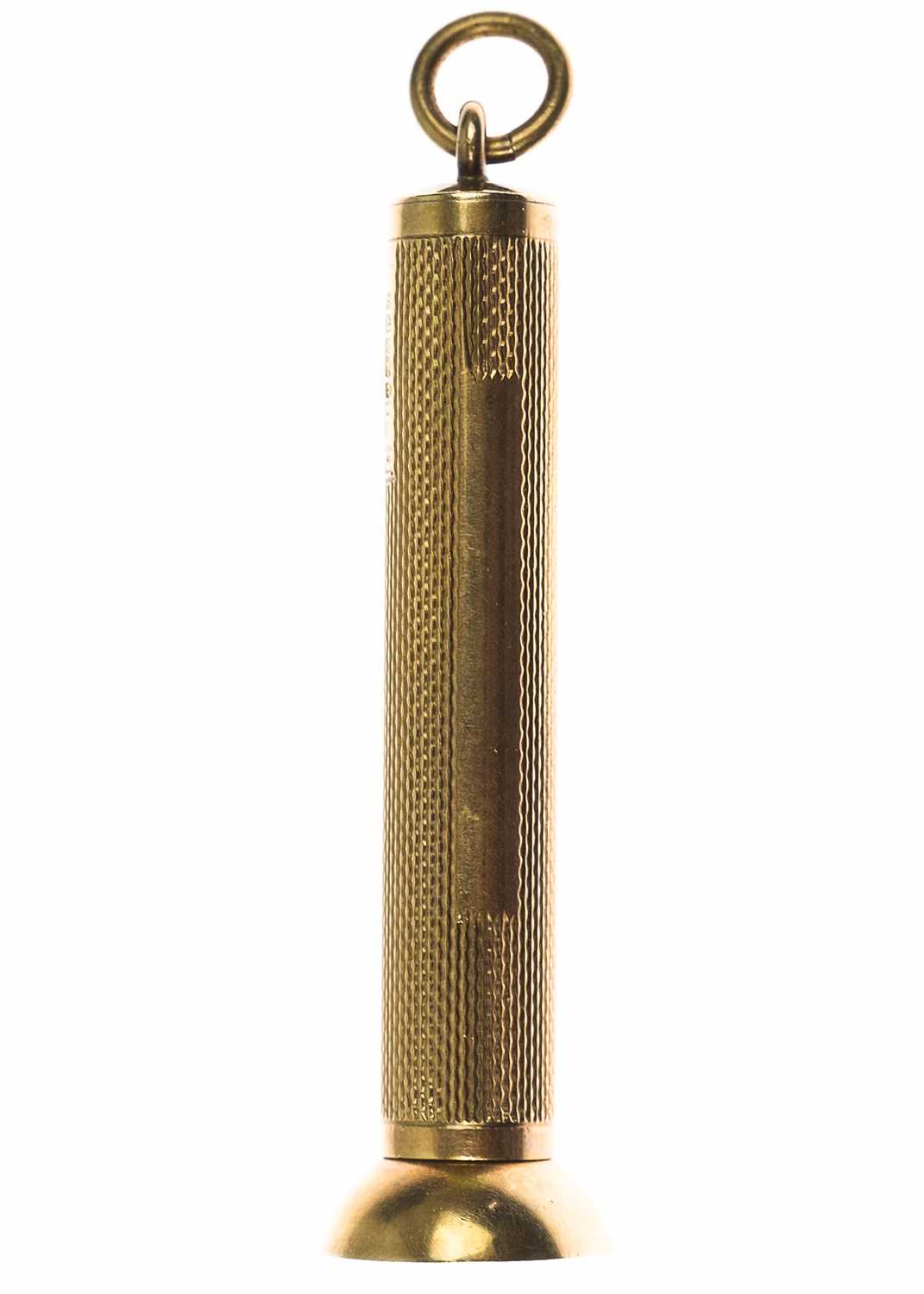 Lot 90 - A 9ct engine-turned cigar pricker fob.