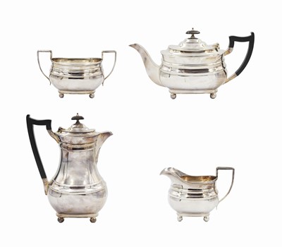 Lot 157 - A silver-plated four piece tea set.