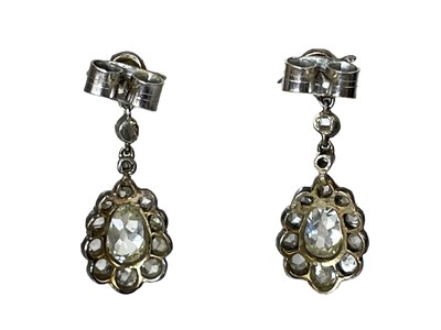 Lot 42 - A pair of 19th century silver diamond set pendant earrings.