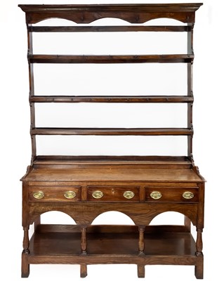 Lot 121 - A George III oak dresser.