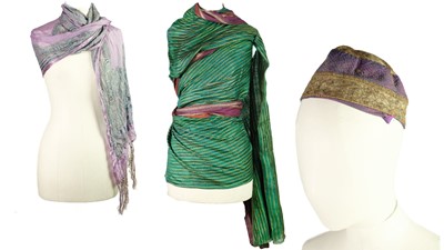 Lot 5 - A selection of Asian textiles including an Islamic embroidered cap and an Indian sari.