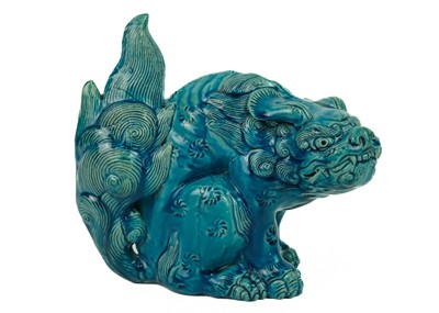 Lot 9 - A Chinese turquoise glazed pottery 'Lion' dog, circa 1900, late Qing Dynasty.