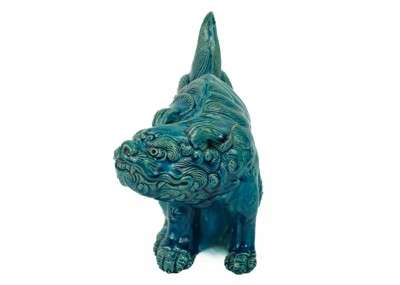 Lot 9 - A Chinese turquoise glazed pottery 'Lion' dog, circa 1900, late Qing Dynasty.