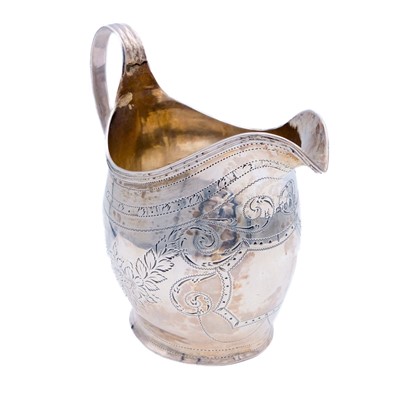 Lot 4 - A George III silver helmet form cream jug by Peter, Anne & William Bateman.