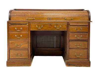 Lot 585 - An Edwardian mahogany roll top desk.