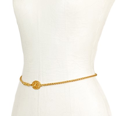 Lot 465 - A Chanel 24ct gold-plated belt with CC pierced medallion buckle, circa 1995.