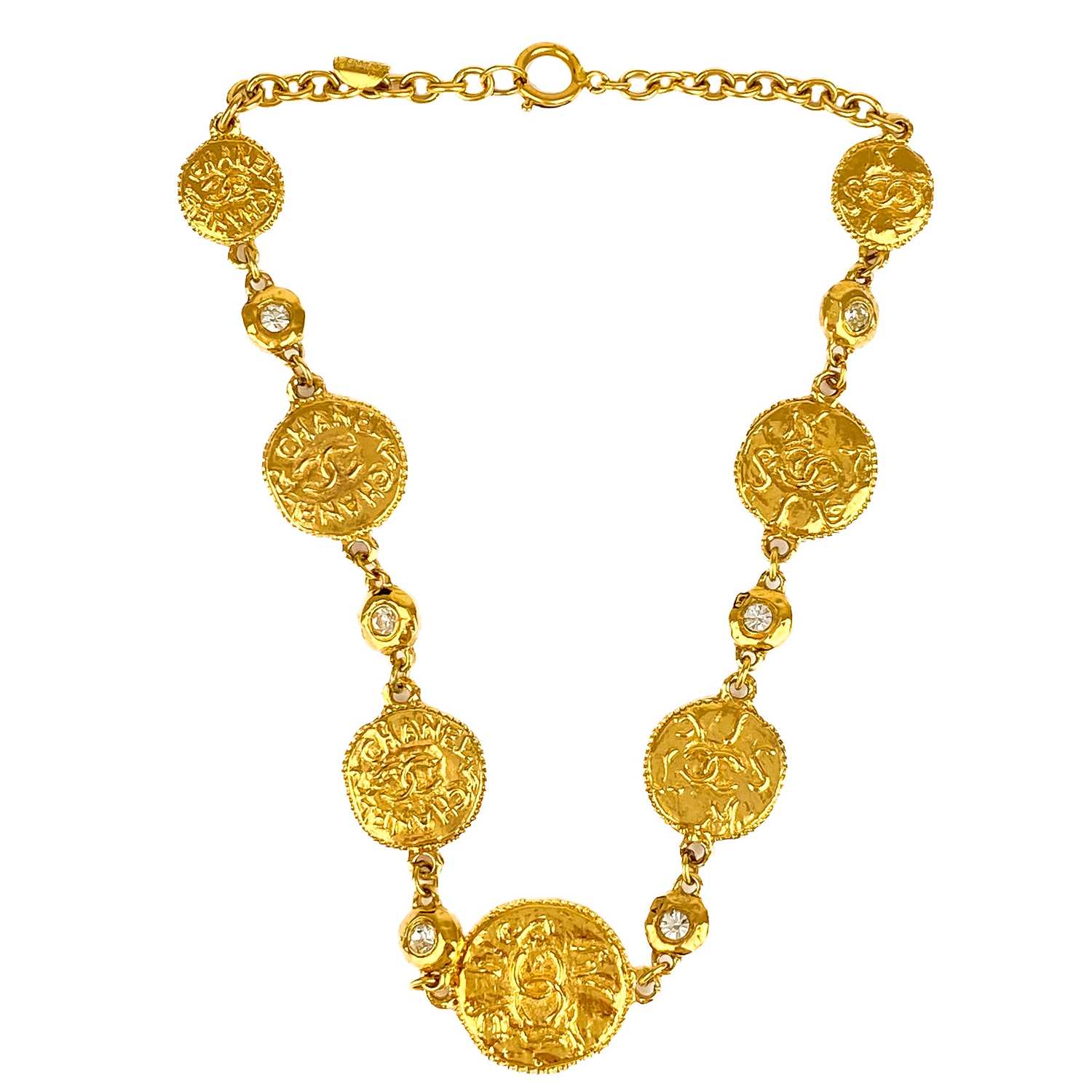 Lot 529 - A Chanel 24ct gold-plated crystal set medallion necklace, circa 1971-80.