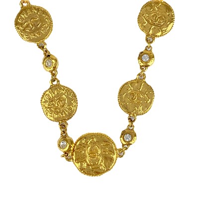 Lot 529 - A Chanel 24ct gold-plated crystal set medallion necklace, circa 1971-80.