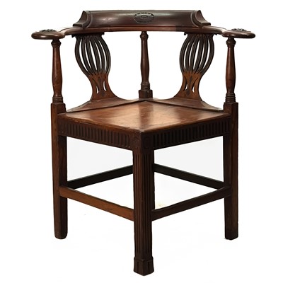 Lot 163 - A late George III fruitwood corner chair.