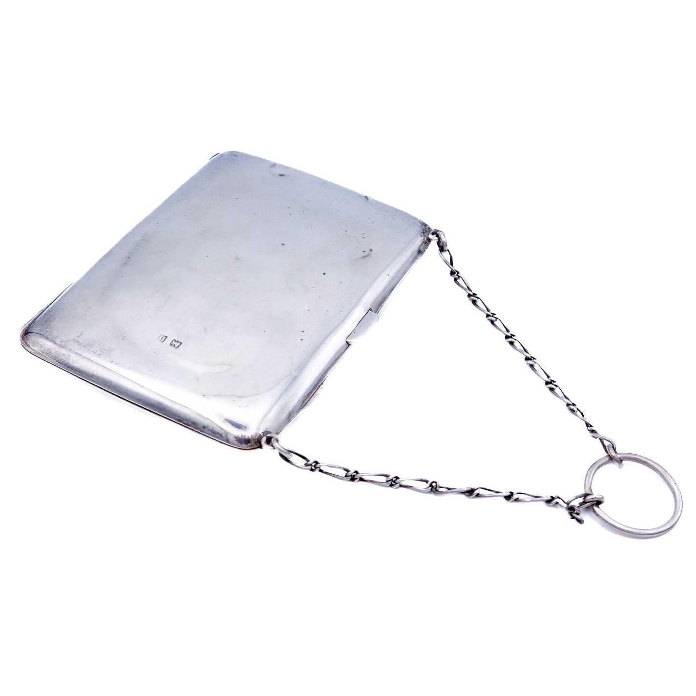 Lot 39 - A George V silver purse with chain.