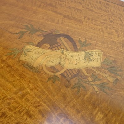 Lot 20 - An Edwardian satinwood inlaid fold over swivel card table.