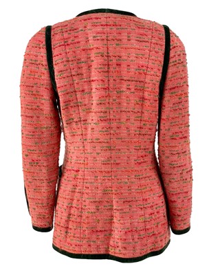 Lot 528 - A Chanel pink boucle tweed and green velvet trim jacket, circa 1990.