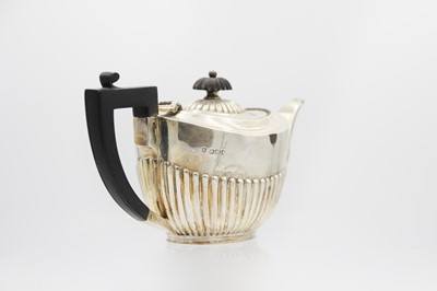 Lot 43 - A Victorian silver half-fluted bachelor teapot by James Dixon & Son.