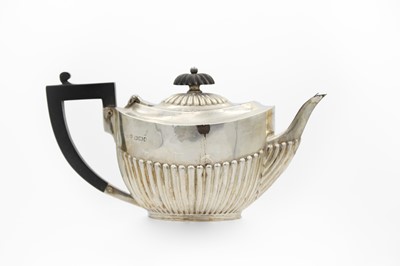 Lot 43 - A Victorian silver half-fluted bachelor teapot by James Dixon & Son.