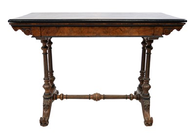 Lot 99 - A Victorian burr walnut and ebonised fold over swivel top card table.