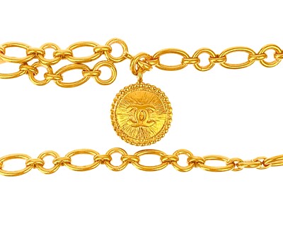 Lot 535 - A Chanel 24ct gold-plated chain belt with CC medallion.