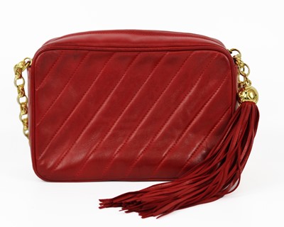 Lot 16 - A Chanel red lambskin leather camera bag, circa 1991-1994.