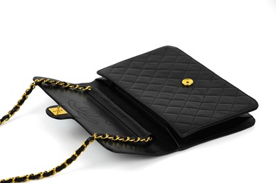 Lot 388 - A Chanel black quilted lambskin single flap wallet shoulder bag.