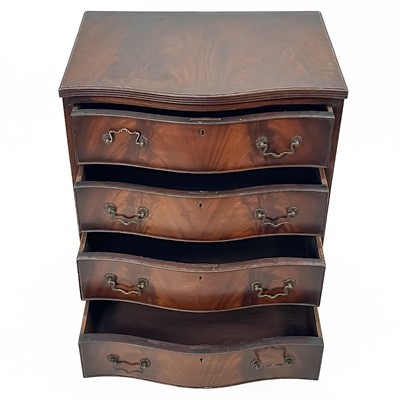 Lot 81 - A diminutive Georgian style serpentine fronted mahogany chest of drawers.