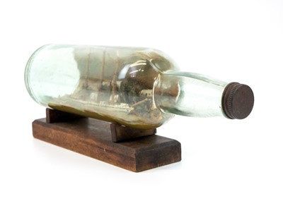 Lot 262 - A model ship in a bottle.